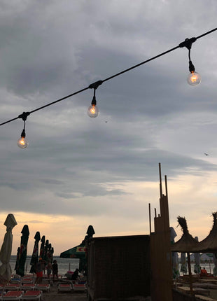 Lichterkette mit Pendel 10M mit 25 Glühlampen E12 7W, Dimmbar, Schwarzes Kabel, Warm Licht, Verbindbar 40M, für Außen